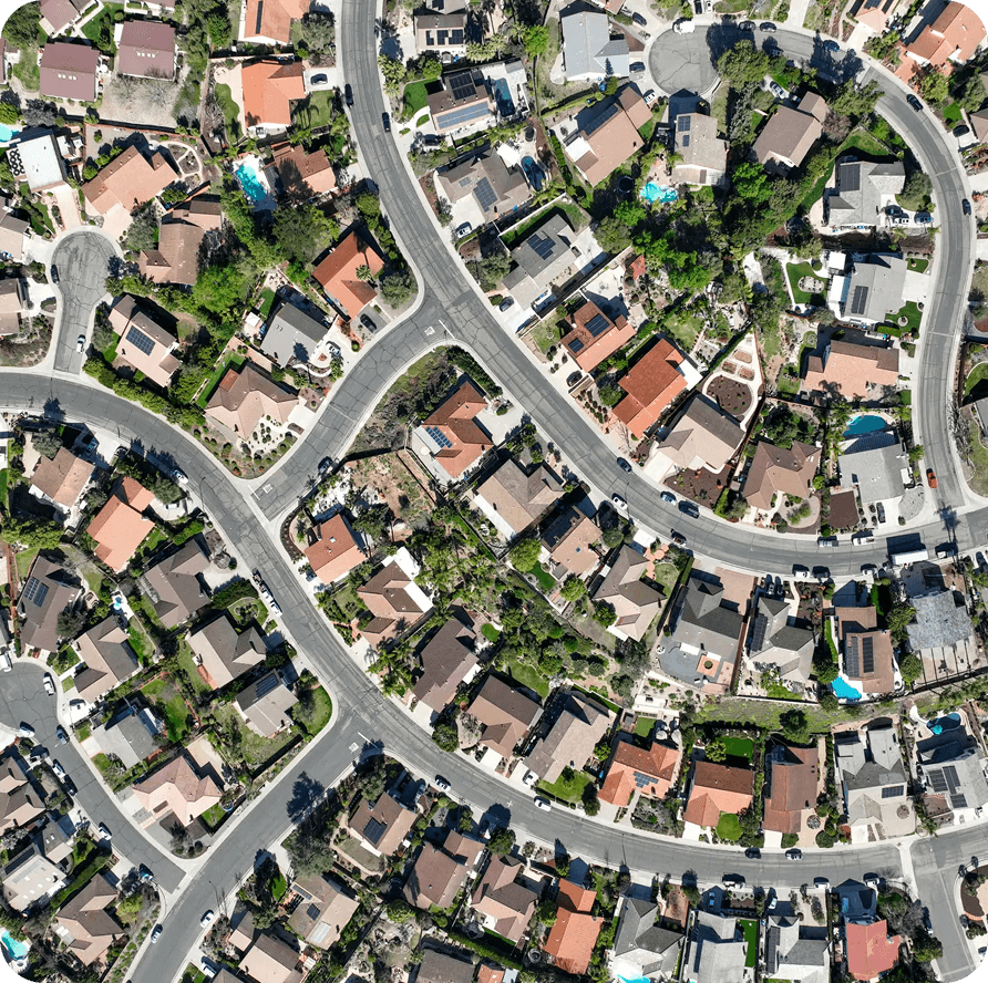 Aerial view of suburban neighborhood with roads.